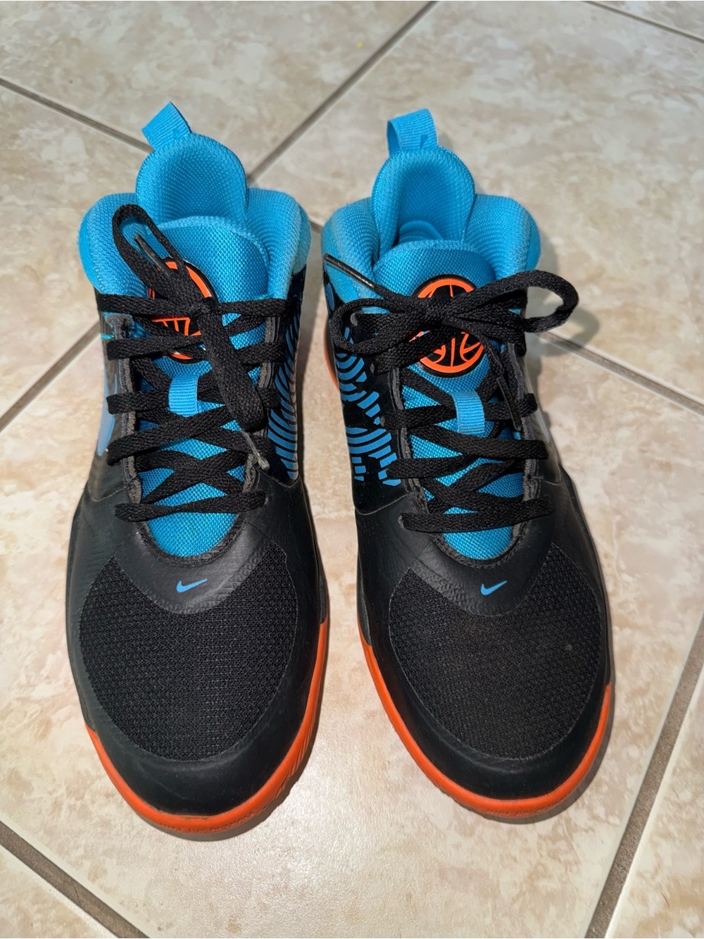Nike Kids Black Sneakers with Bright Blue Lining and Orange Soles